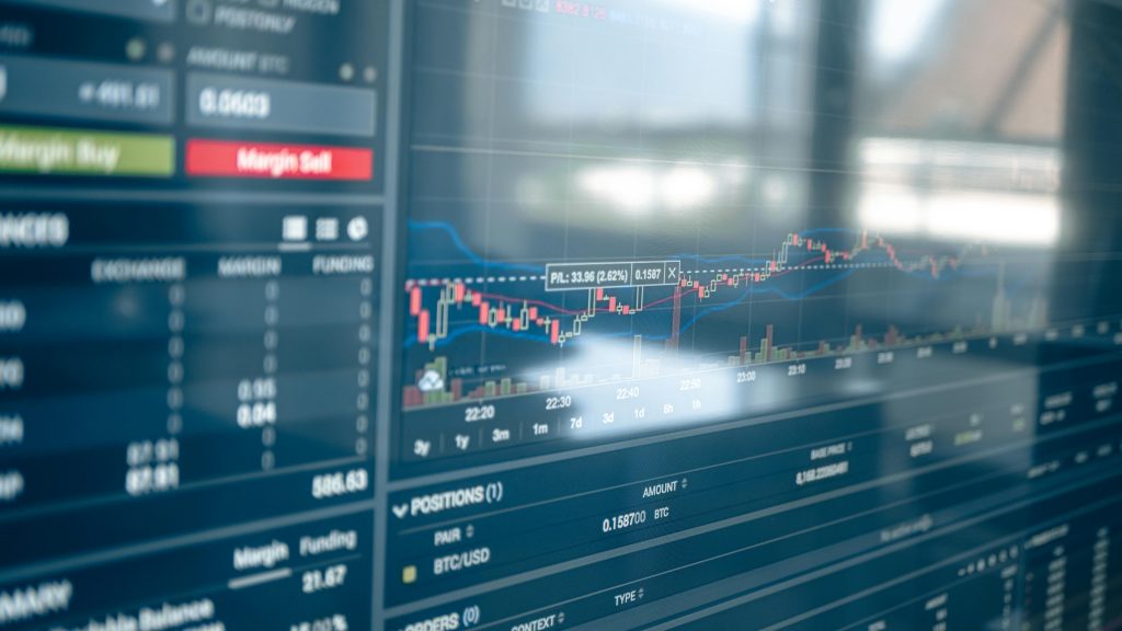 A chart displaying a significant drop in cryptocurrency prices, with red downward arrows indicating market volatility.