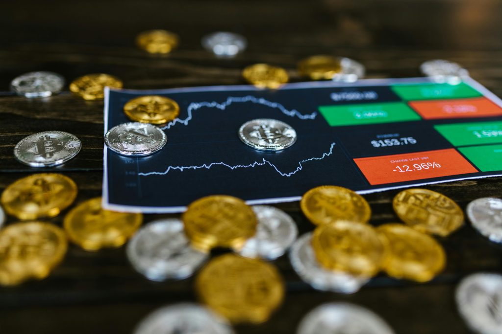 An image of the price/market chart of cryptocurrencies and cryptocurrencies being littered on top of the chart