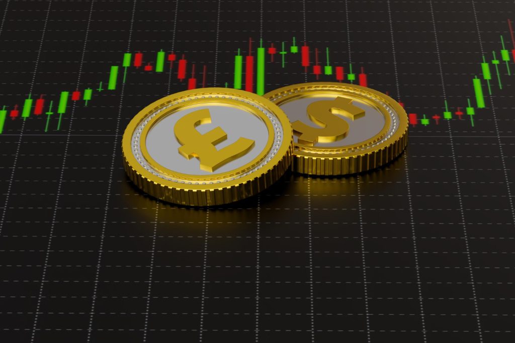 Gold coins with currency symbols (£ and $) placed on a digital trading chart with green and red candlesticks.